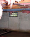 Ohio and Indiana crawl space with vents, showing mold, rot, and fiberglass insulation dripping off the ceiling.