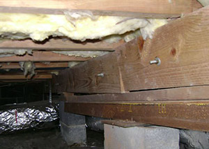 sagging crawl space with wooden shimming a Fairborn crawl space