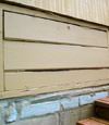 an old-fashioned crawl space door in Troy about to be replaced