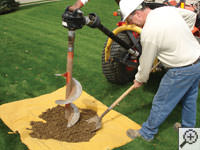 Auguring a hole in the earth for a foundation repair in Independence, KY
