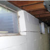 A foundation showing severe inward buckling along the windows in a Xenia home.