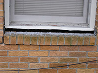 A window sill cracking and separating from the foundation wall in a Dayton home.