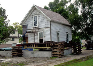 A severely damaged home foundation that is undergoing replacement in Dayton.