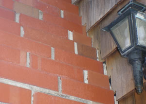 a repaired chimney in Burlington, KY that had shown serious foundation damage and was repaired with a helical pier system.
