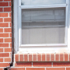 A gap in a window along the outer wall due to foundation settlement of a Fairborn home.