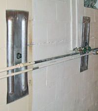 A foundation wall anchor system used to repair a basement wall in Piqua