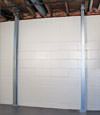 A steel i-beam system installed on a Fort Thomas foundation wall
