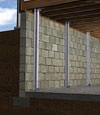 I-beam foundation wall supports installed in a Englewood basement.