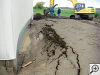 A foundation wall showing severe damage from bowing and buckling in Burlington, KY
