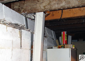 A failing foundation wall and i-beam support in a Cincinnati home