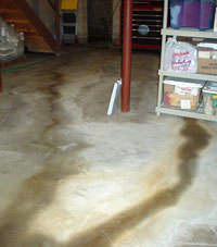 Flooding entering a basement through a floor crack in Latonia, KY