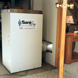 A basement dehumidifier with an ENERGY STAR® rating ducting dry air into a finished area of the basement  in Springboro