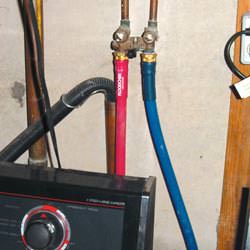 Washer hoses in a basement  in Englewood