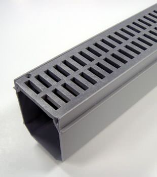 A closeup of our grated basement drainage pipe system, installed in Oxford