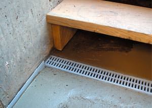 a hatchway entrance in Latonia, KY that has been protected from flooding by our TrenchDrain basement drainage system.