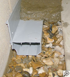 A no-clog basement french drain system installed in Fort Michell, KY